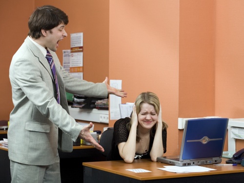 Businessman shouting at his colleague in the office